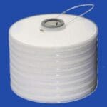 A roll of white paper with a string attached to it.