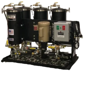 Industrial equipment with multiple black cylindrical tanks and control panel.